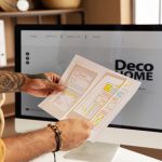 Man designing a website on a computer